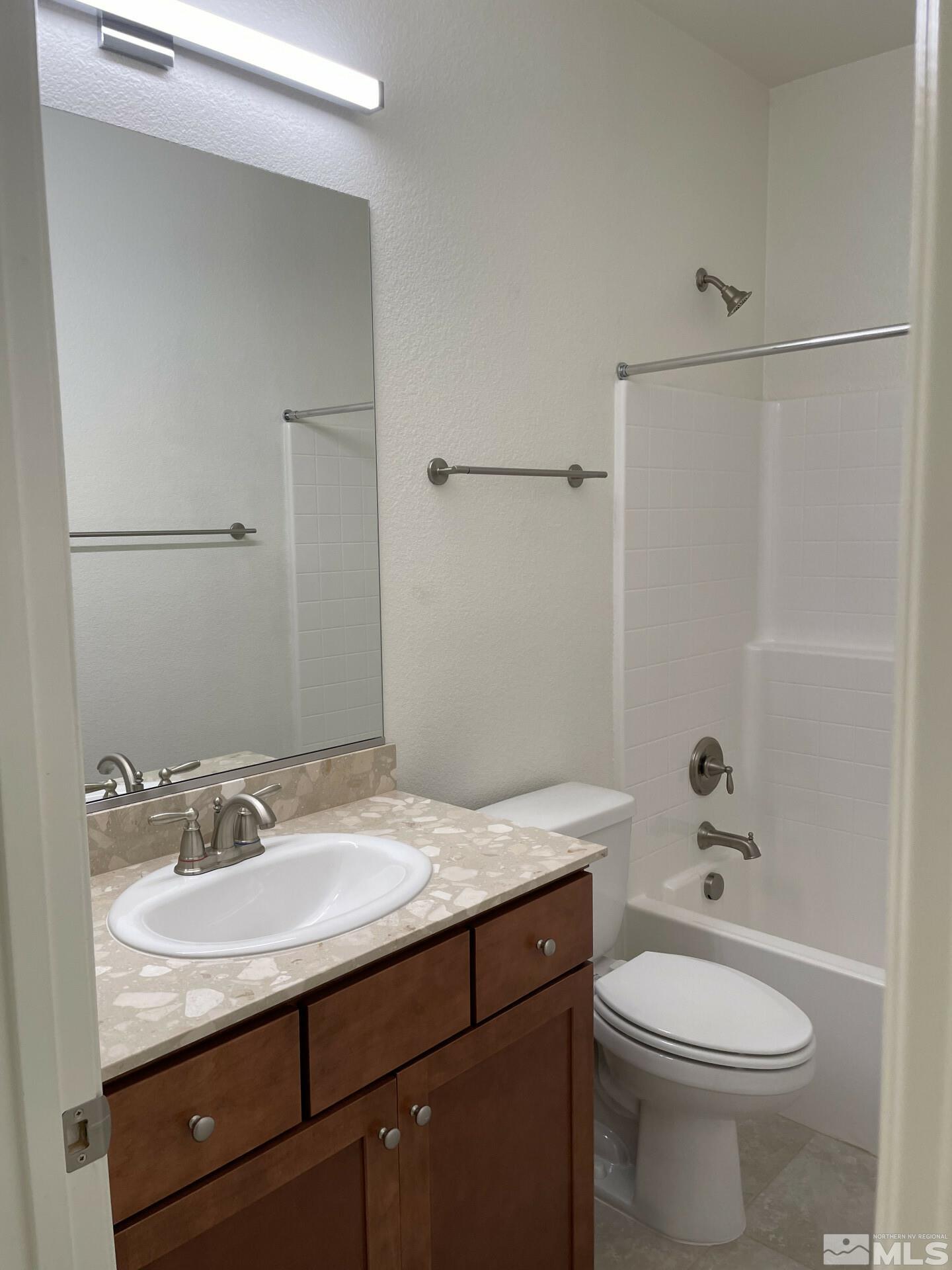 2087 Whitecliff Drive Reno, NV 89521 - Photo 22 of 33 a bathroom with a granite countertop sink toilet and shower