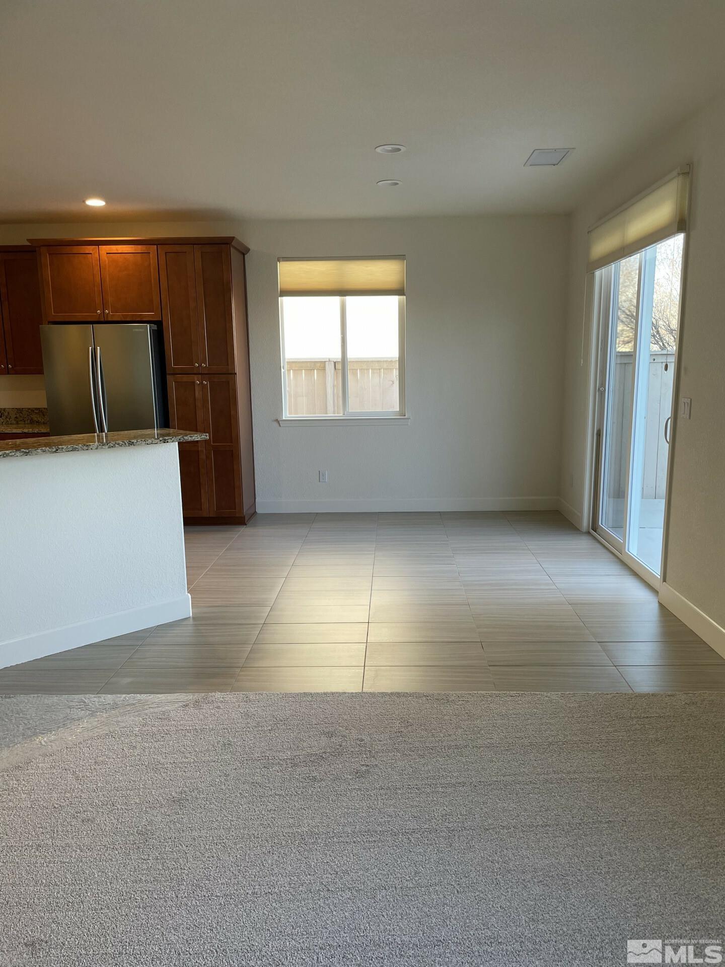 2087 Whitecliff Drive Reno, NV 89521 - Photo 5 of 33 a view of empty room with wooden floor and entryway