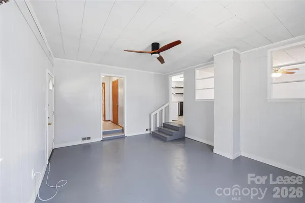 a view of an empty room with a window