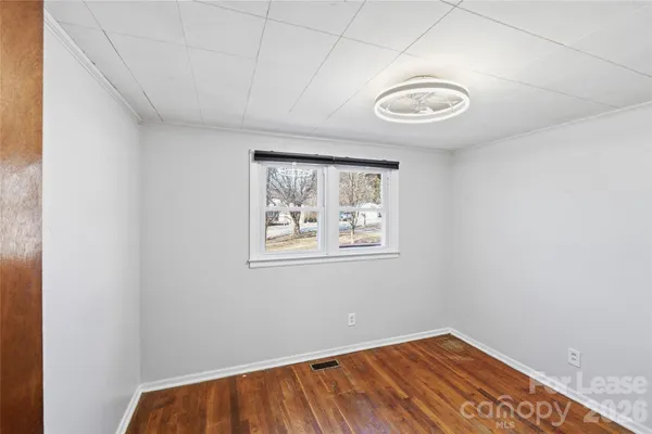 a view of a room with a large window