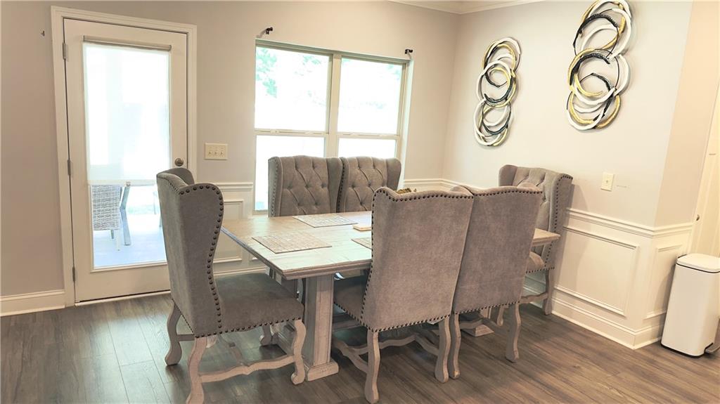 3370 Elkhorn Ridge Run Dacula, GA 30019 - Photo 5 of 29 a view of a dining room with furniture window and wooden floor
