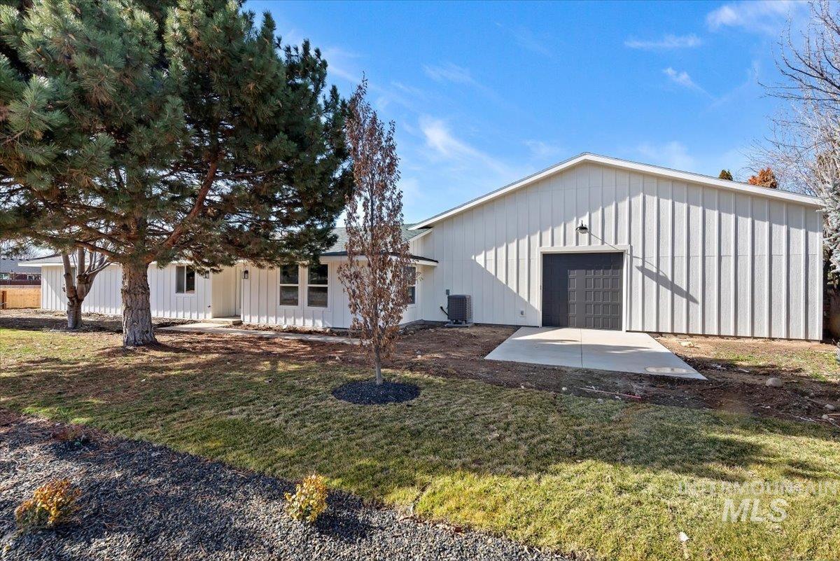 2435 North Black Cat Road Meridian, ID 83646 - Photo 32 of 32 View of front of home featuring board and batten siding, a front yard, and a patio area