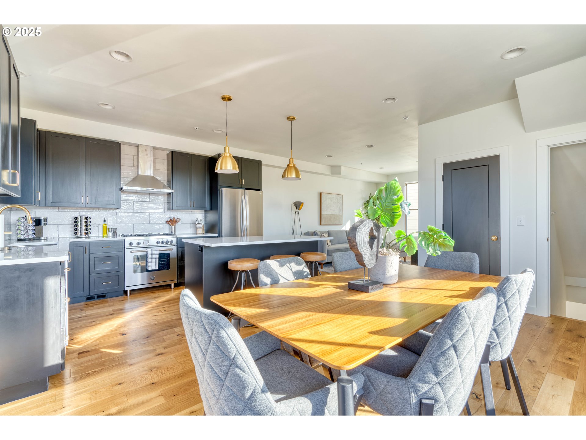 508 Northeast 56th Avenue Portland, OR 97213 - Photo 14 of 38 a room with kitchen island a table and chairs in it