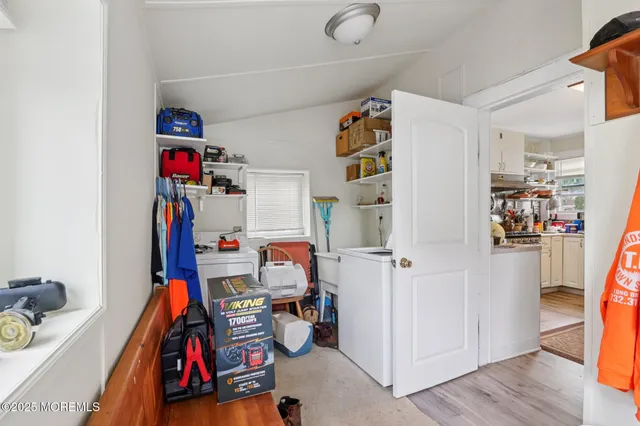 a room with furniture a rug and a chandelier