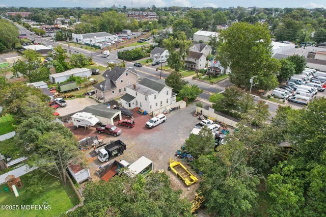 a view of a park that has a tree on the side of it
