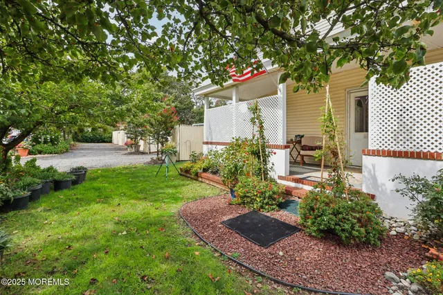 a balcony with furniture and flowers