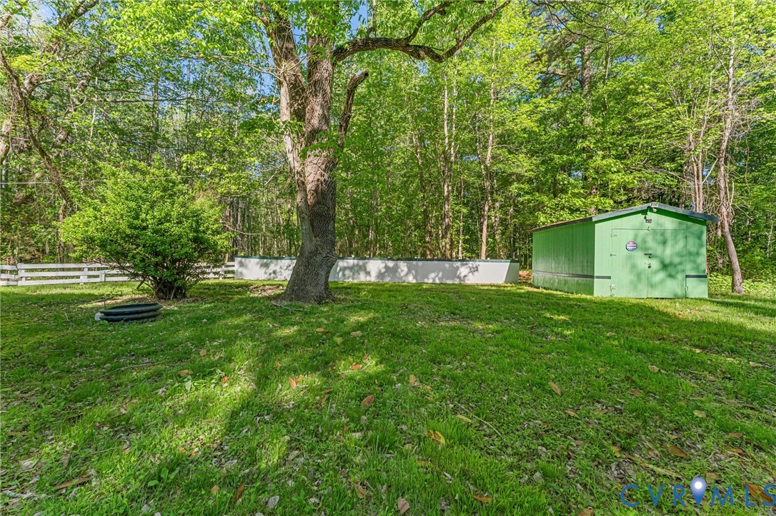 2097 Coles Point Road Hague, VA 22469 - Photo 5 of 34 a view of green field with trees in the background