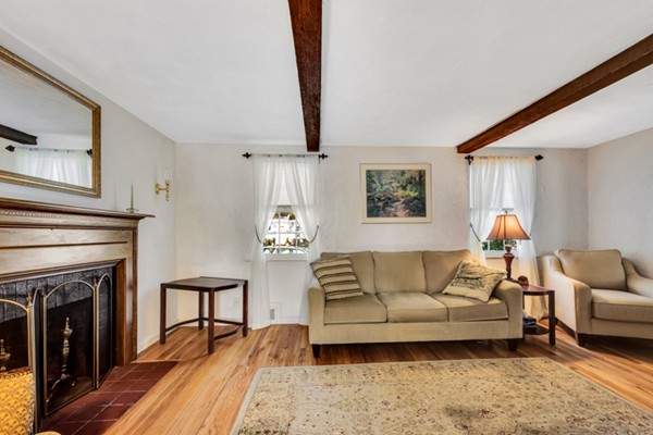 25 Mayflower Road Arlington, MA 02478 - Photo 3 of 21 a living room with furniture and a fireplace