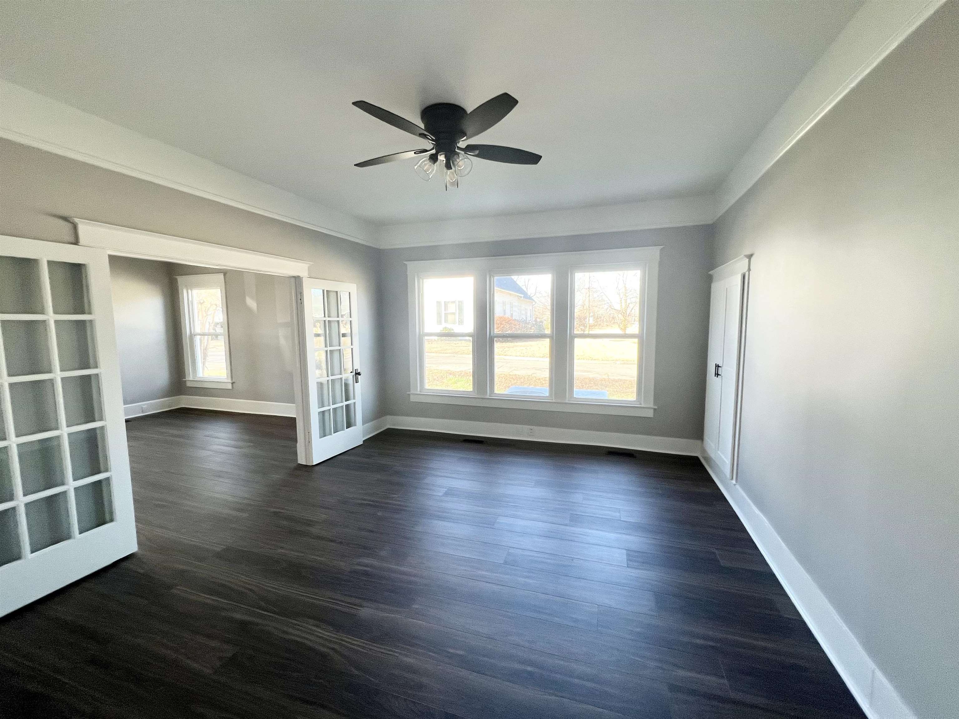 129 Wardlaw Circle Ripley, TN 38063 - Photo 15 of 24 a view of an empty room with a window and wooden floor