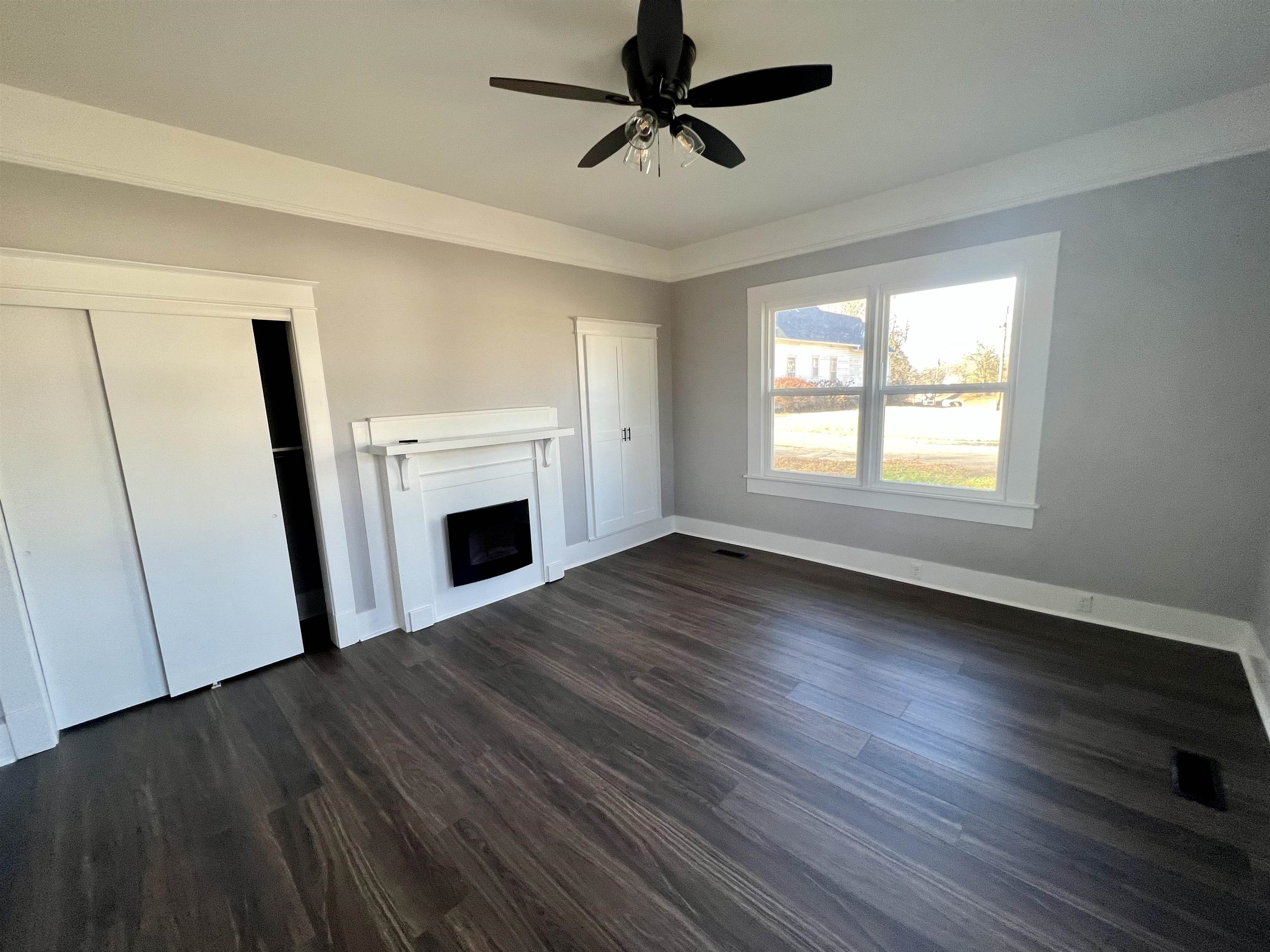 129 Wardlaw Circle Ripley, TN 38063 - Photo 18 of 24 a view of empty room with wooden floor and fireplace