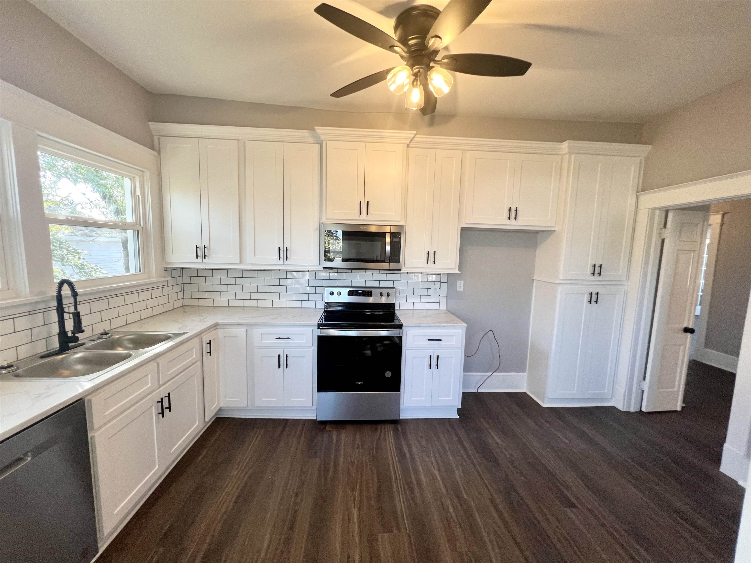 129 Wardlaw Circle Ripley, TN 38063 - Photo 8 of 24 a kitchen with a stove a sink and a refrigerator