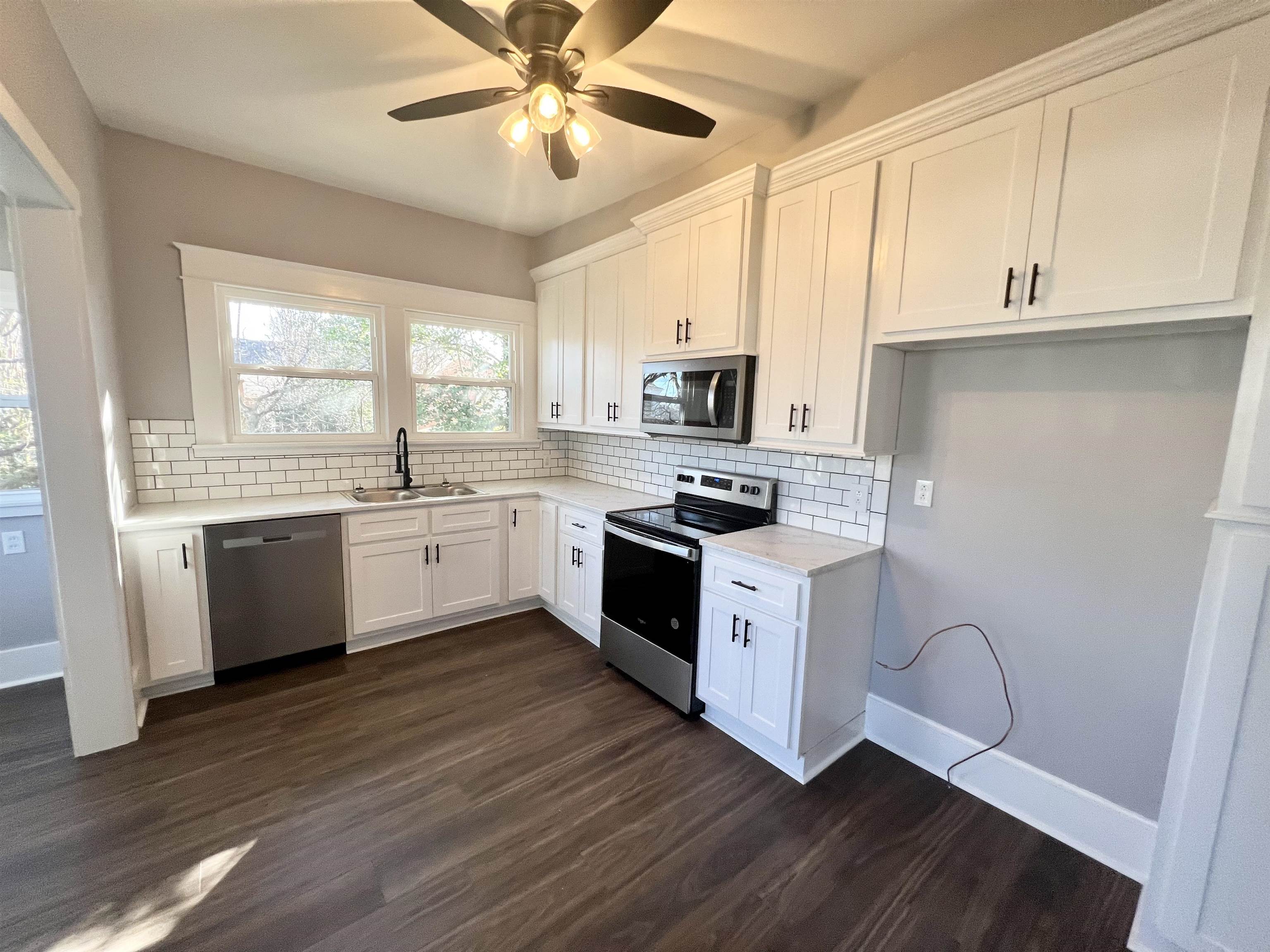 129 Wardlaw Circle Ripley, TN 38063 - Photo 9 of 24 a kitchen with a white cabinets and window