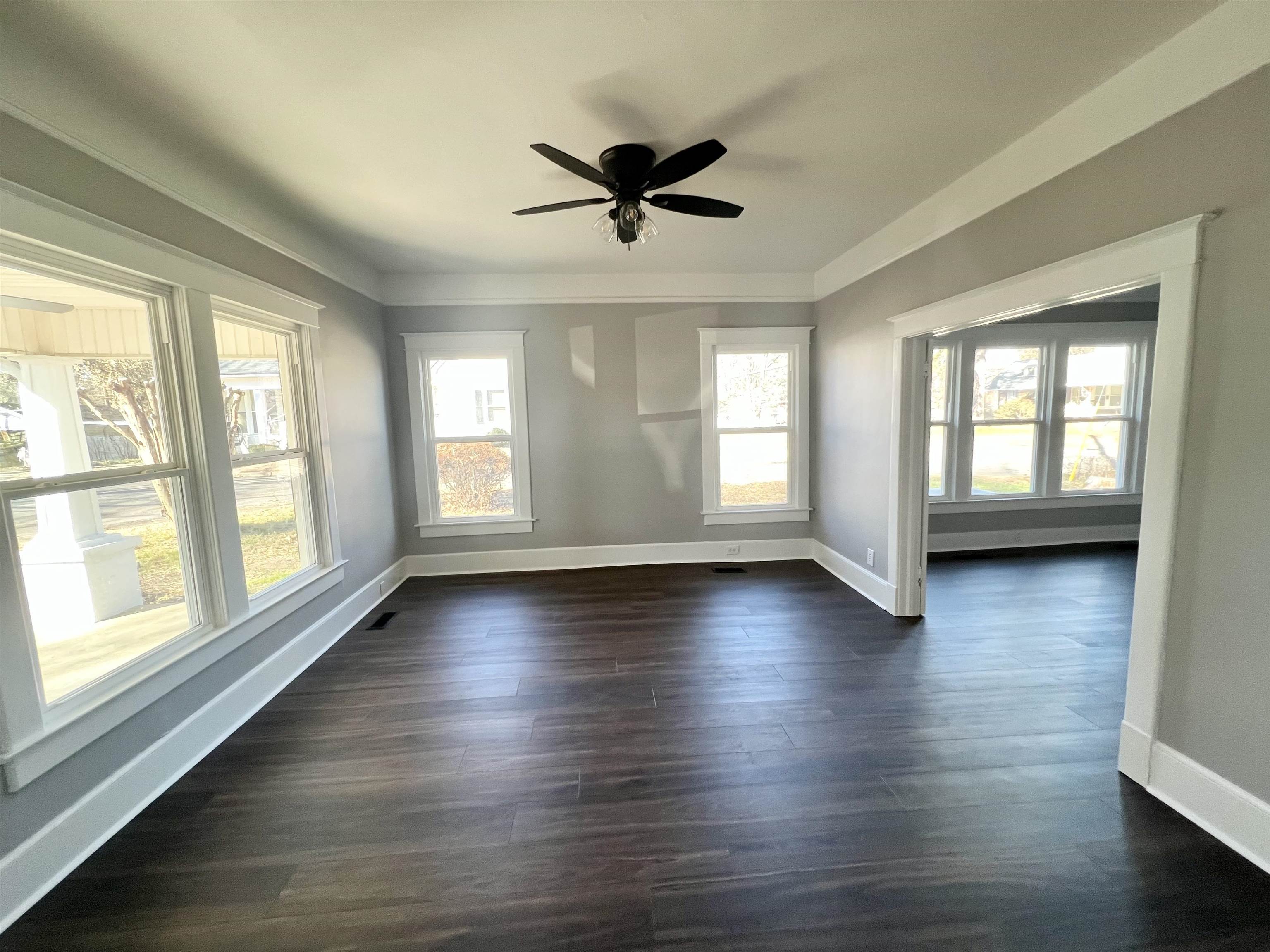129 Wardlaw Circle Ripley, TN 38063 - Photo 10 of 24 a view of an empty room with wooden floor and a window