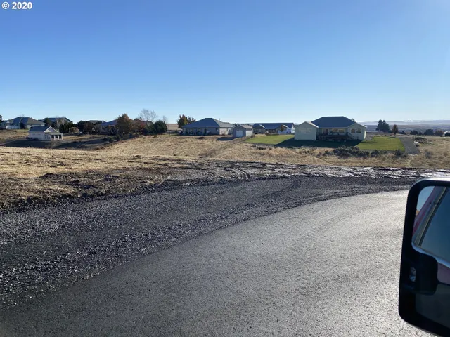 a view of a road with an ocean view