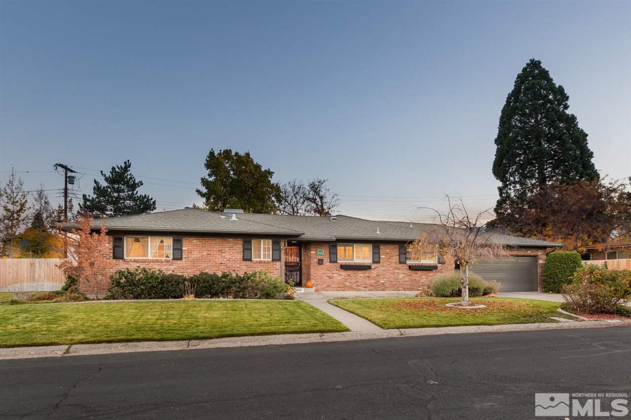 1480 Romero Way Reno, NV 89509 - Photo 1 of 1 a front view of a house with a yard and garage