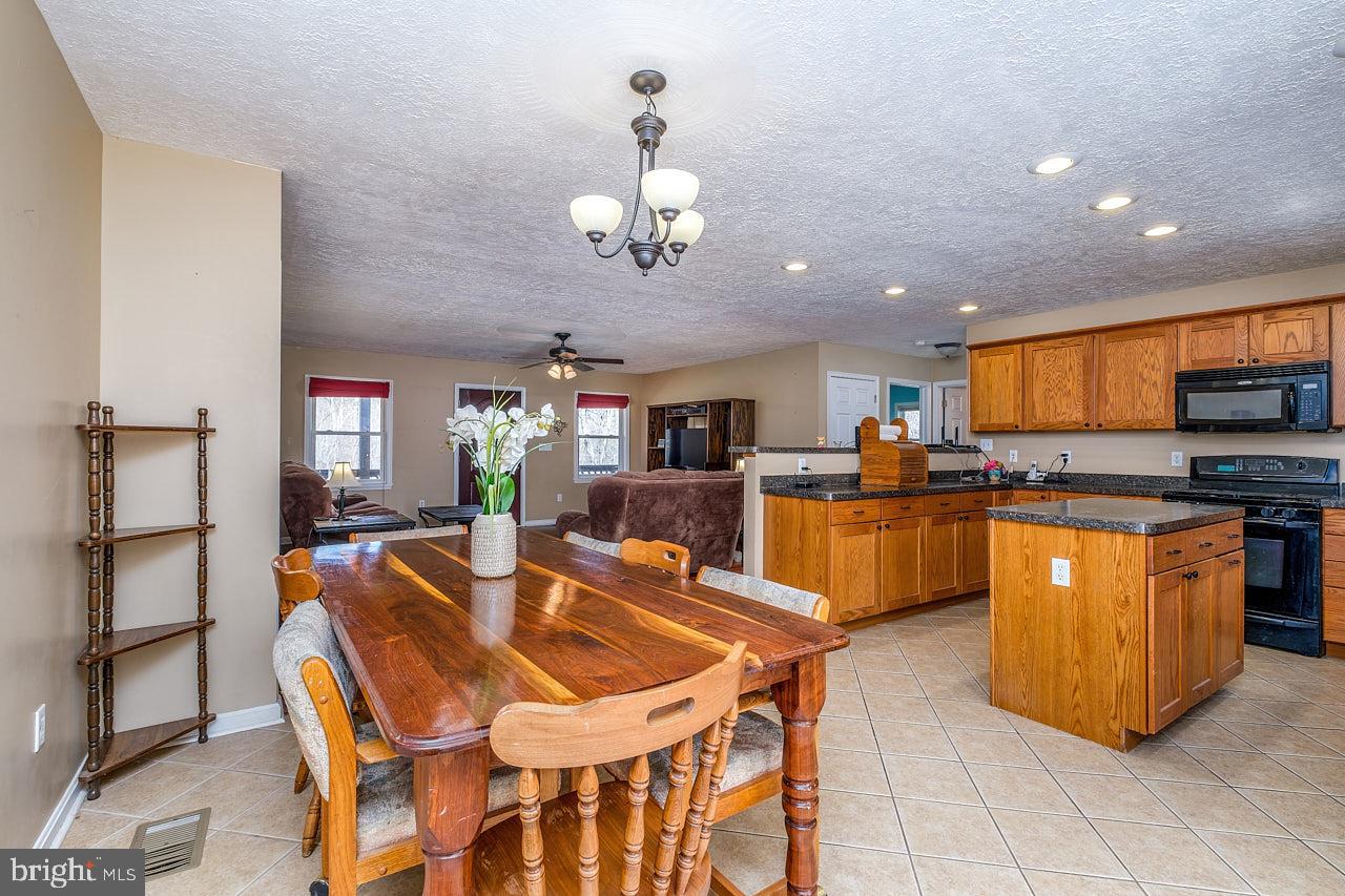 2352 Stultz Gap Road Woodstock, VA 22664 - Photo 5 of 32 Tiled kitchen and dining area.