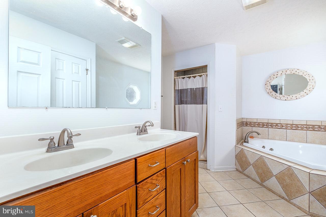 2352 Stultz Gap Road Woodstock, VA 22664 - Photo 7 of 32 Dual vanities and soaking tub.