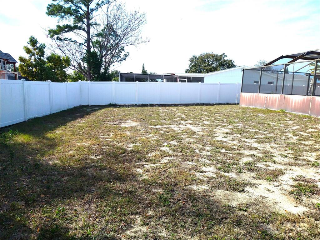8415 Briarleaf Court Port Richey, FL 34668 - Photo 26 of 27 a view of a backyard