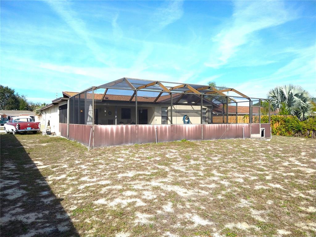 8415 Briarleaf Court Port Richey, FL 34668 - Photo 27 of 27 a view of a house with a yard