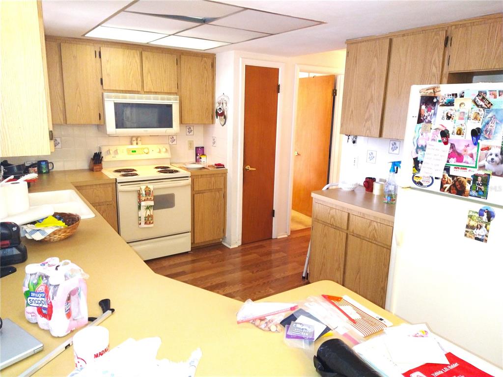 8415 Briarleaf Court Port Richey, FL 34668 - Photo 9 of 27 a bedroom with a bed and a dresser