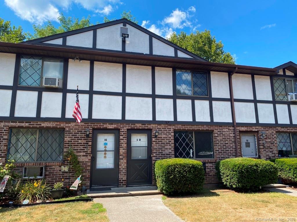 2 Branch Road, Unit 1D Thomaston, CT 06787 - Photo 1 of 1 a front view of a house with a yard