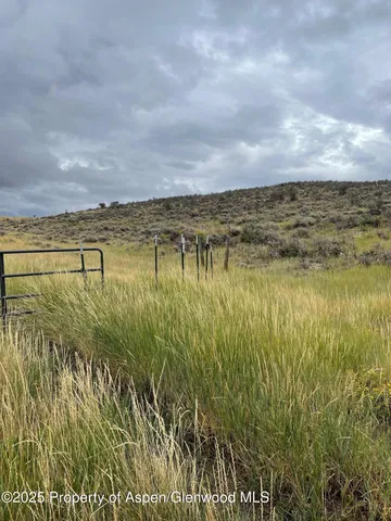 a view of a lake with a big yard