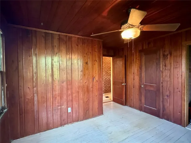 a view of entryway with a wooden door