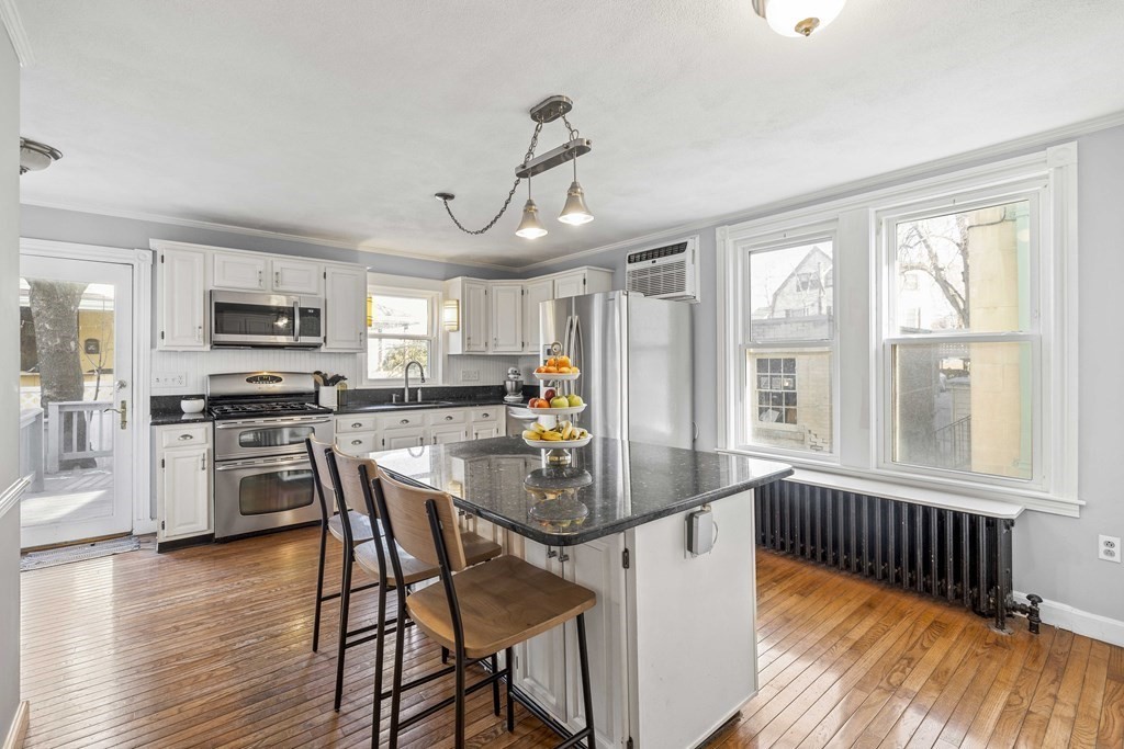 37 Lynn Shore Drive Lynn, MA 01902 - Photo 14 of 42 a dining room with furniture a window and wooden floor