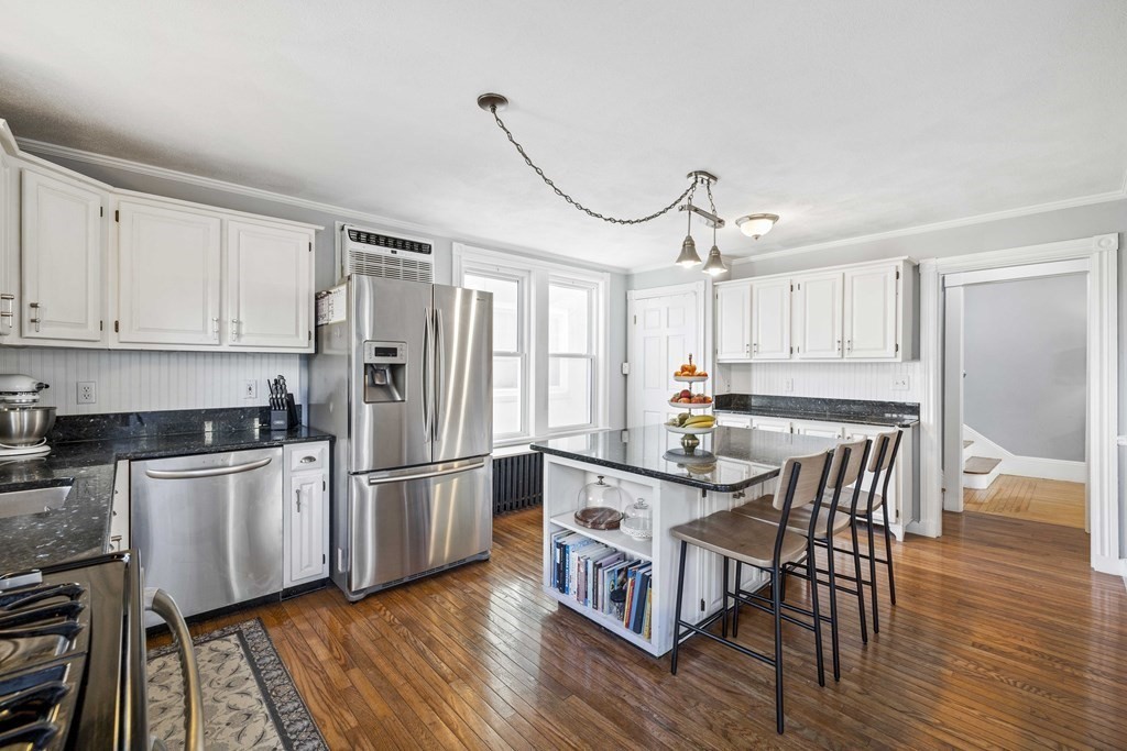 37 Lynn Shore Drive Lynn, MA 01902 - Photo 15 of 42 a kitchen with stainless steel appliances granite countertop a kitchen island hardwood floor and a sink