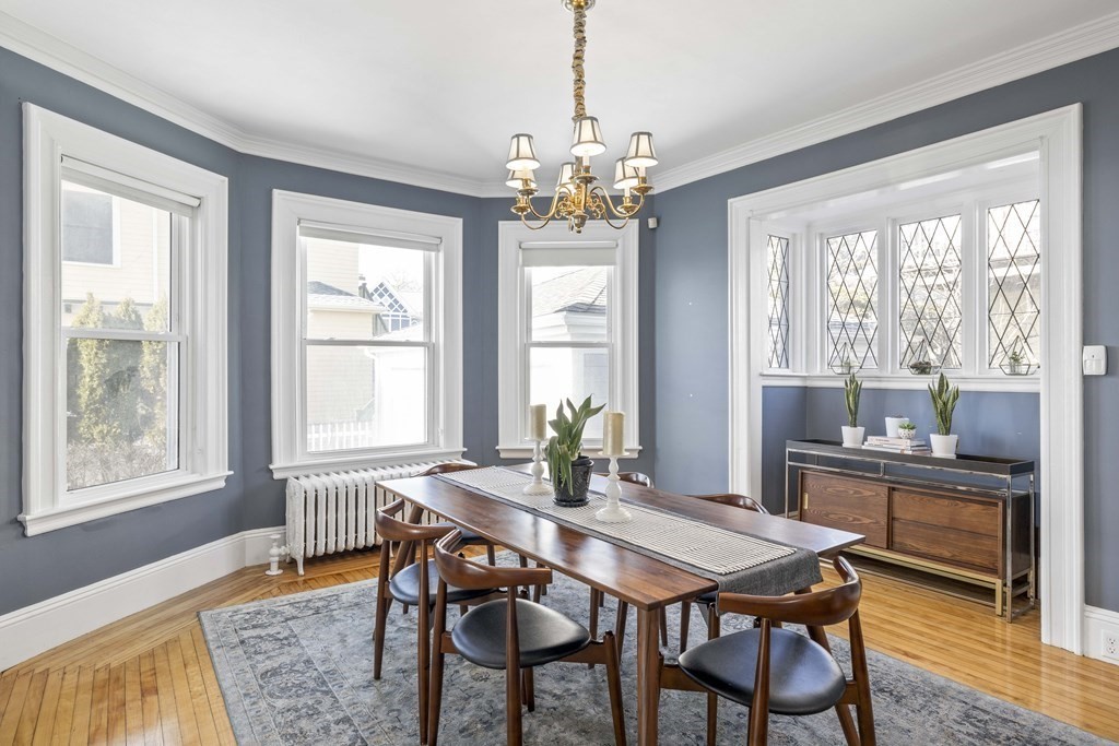 37 Lynn Shore Drive Lynn, MA 01902 - Photo 17 of 42 a dining room with furniture a chandelier and wooden floor