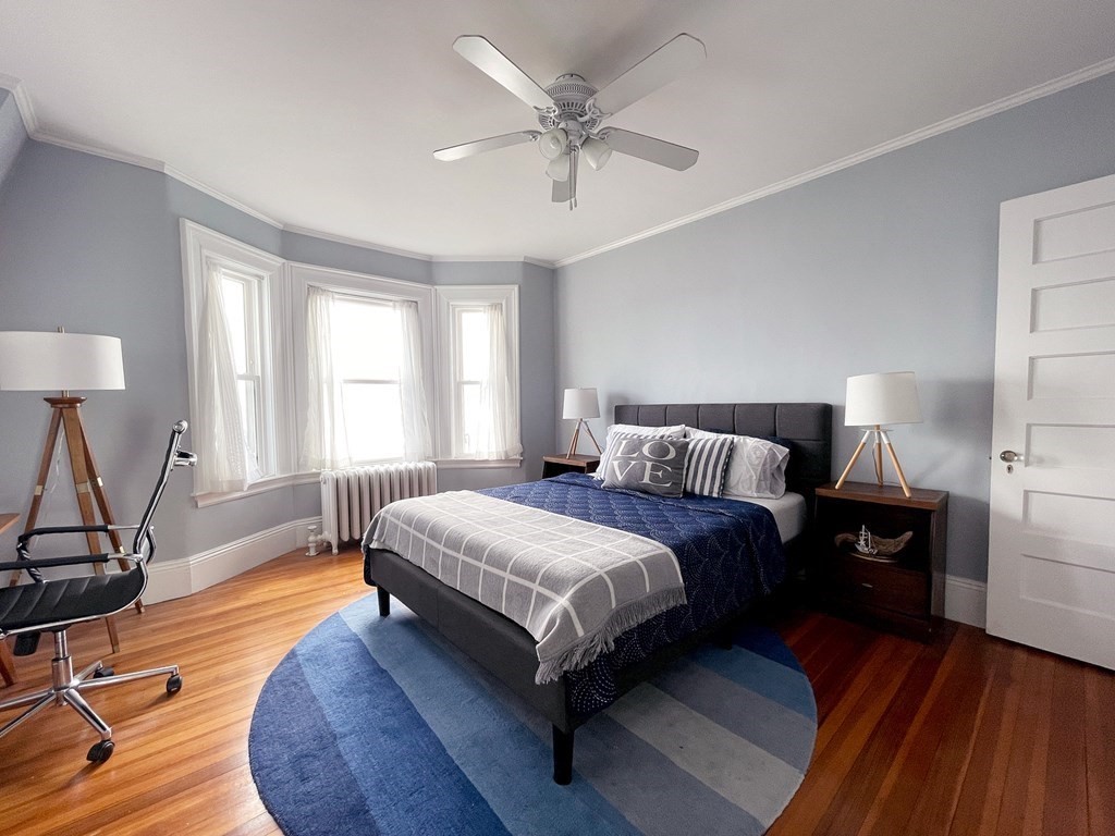37 Lynn Shore Drive Lynn, MA 01902 - Photo 22 of 42 a spacious bedroom with a bed and wooden floor