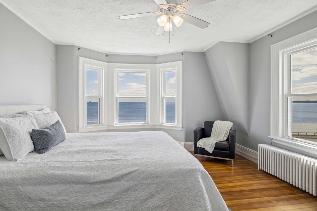 37 Lynn Shore Drive Lynn, MA 01902 - Photo 24 of 42 a bedroom with a bed and wooden floor