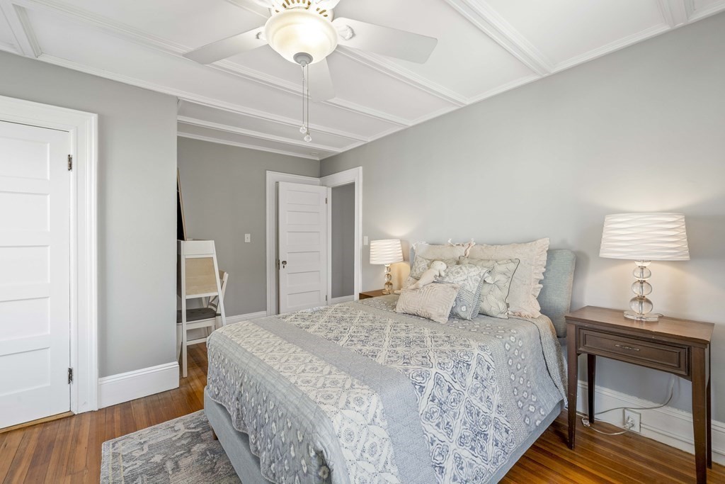 37 Lynn Shore Drive Lynn, MA 01902 - Photo 25 of 42 a bedroom with a bed and a lamp on table