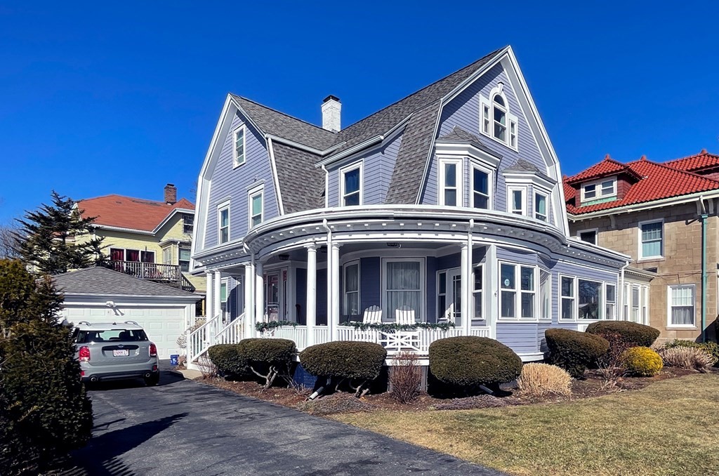 37 Lynn Shore Drive Lynn, MA 01902 - Photo 3 of 42 a front view of a building with lot of cars and trees