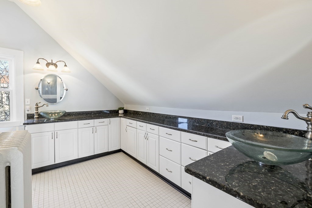 37 Lynn Shore Drive Lynn, MA 01902 - Photo 33 of 42 a kitchen with granite countertop a sink and a white cabinets
