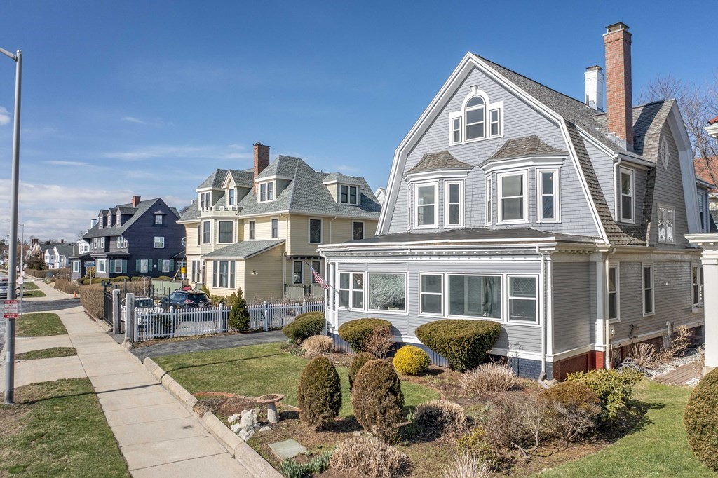 37 Lynn Shore Drive Lynn, MA 01902 - Photo 4 of 42 a front view of a residential apartment building with a yard