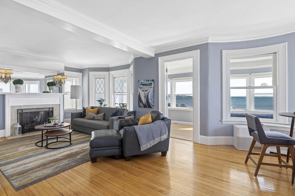 37 Lynn Shore Drive Lynn, MA 01902 - Photo 9 of 42 a living room with furniture and a fireplace