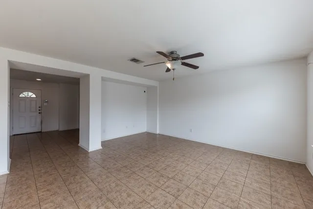a view of a livingroom with a kitchen