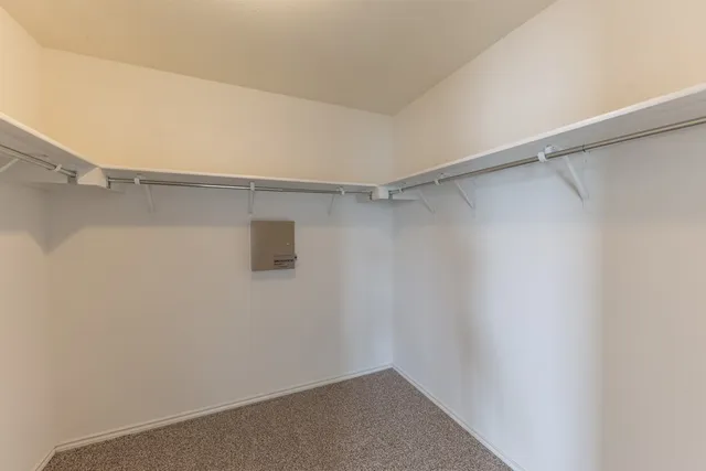 a bathroom with a double vanity sink toilet and a mirror