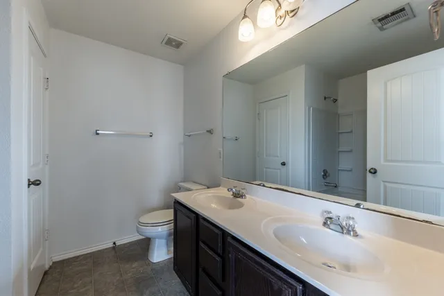 a view of room with window and ceiling fan