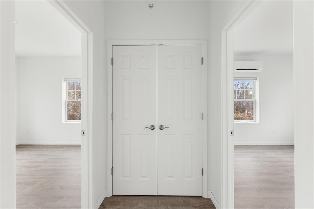 50 R Maplewood Avenue, Unit 215 Gloucester, MA 01930 - Photo 11 of 14 an empty room with windows