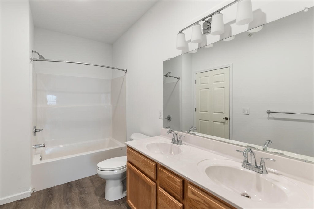 50 R Maplewood Avenue, Unit 215 Gloucester, MA 01930 - Photo 9 of 14 a bathroom with a sink toilet and shower