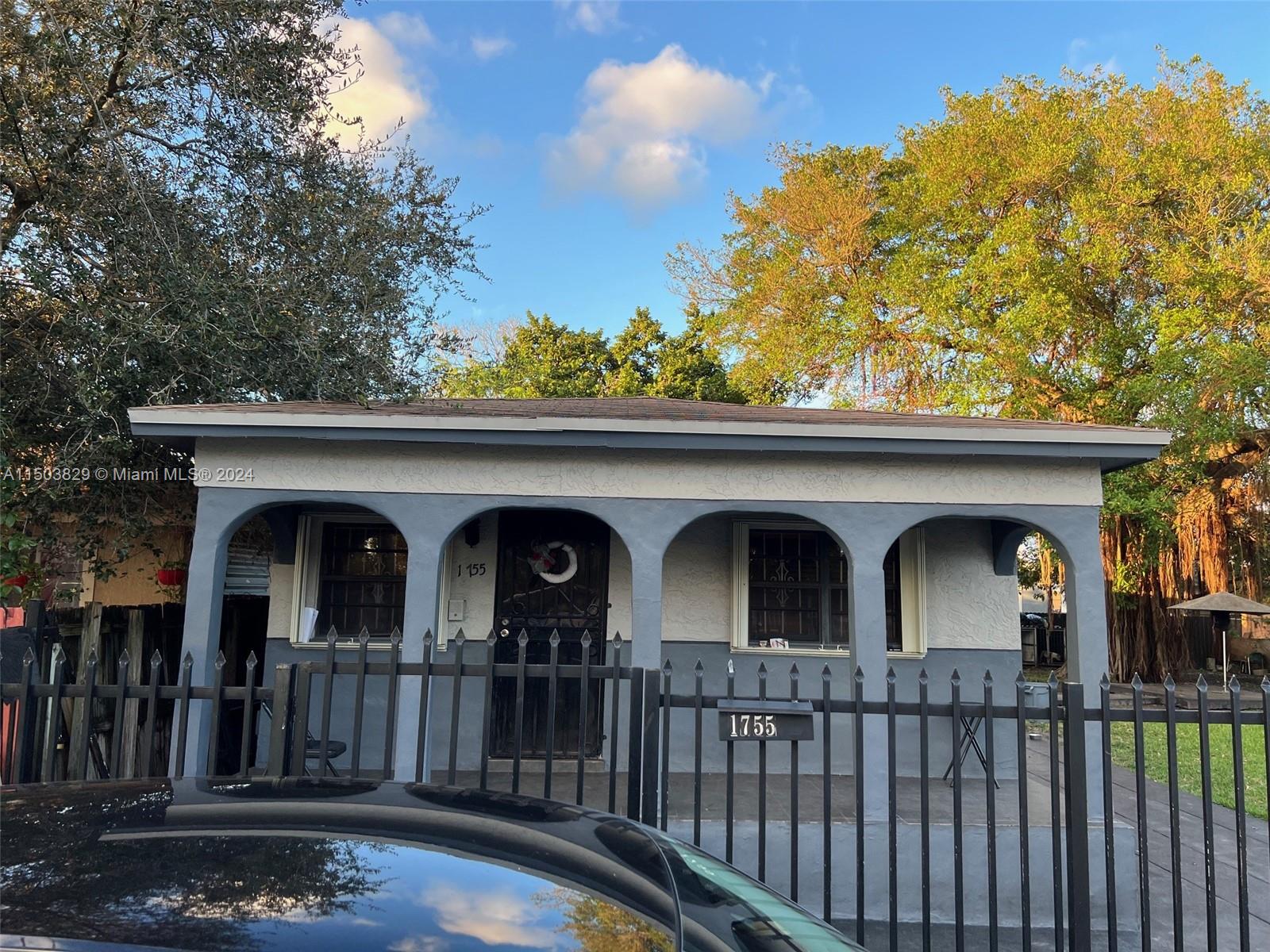 1755 Northwest 69th Street Miami, FL 33147 - Photo 11 of 36 a view of front door