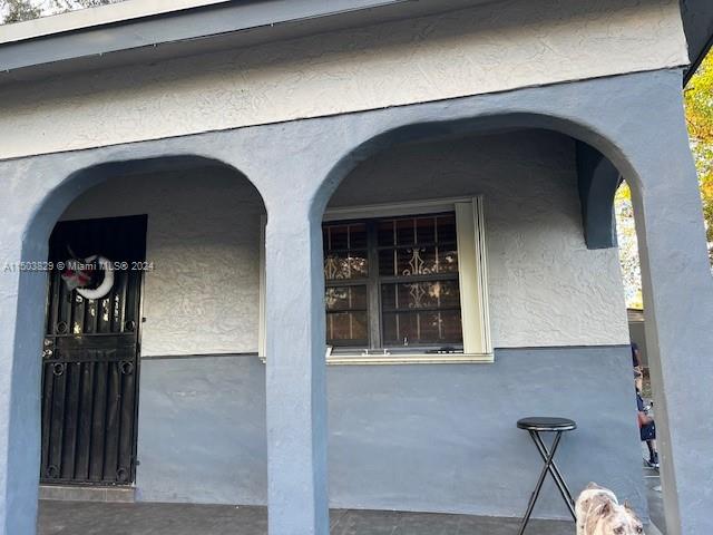 1755 Northwest 69th Street Miami, FL 33147 - Photo 2 of 36 a view of front door