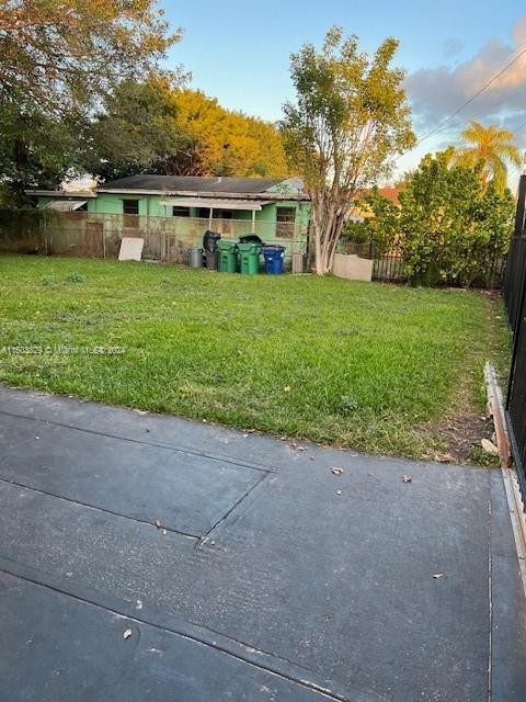 1755 Northwest 69th Street Miami, FL 33147 - Photo 30 of 36 a view of a house with a yard