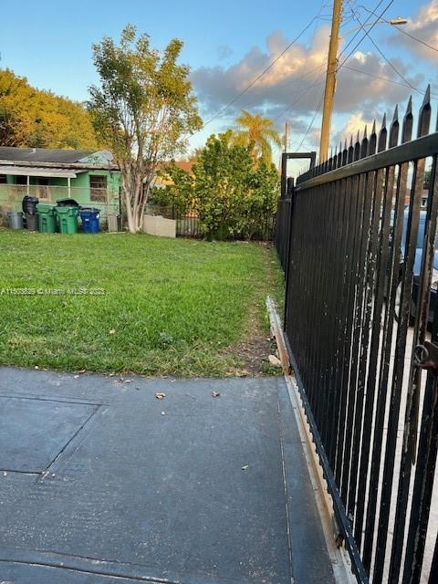 1755 Northwest 69th Street Miami, FL 33147 - Photo 31 of 36 a view of a backyard with a garden
