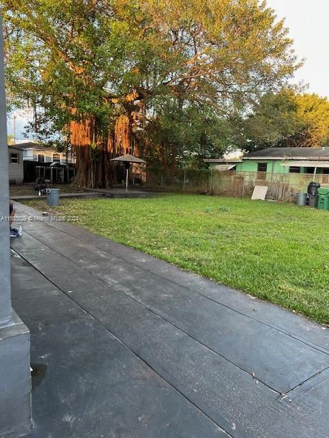 1755 Northwest 69th Street Miami, FL 33147 - Photo 33 of 36 a front view of a house with garden