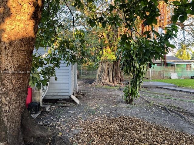 1755 Northwest 69th Street Miami, FL 33147 - Photo 4 of 36 a backyard of a house with lots of green space