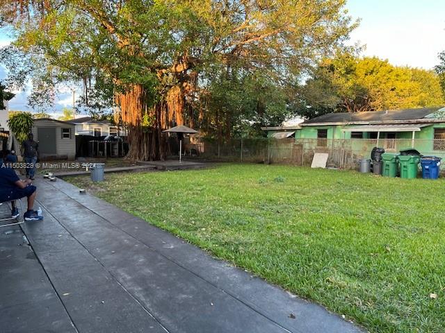 1755 Northwest 69th Street Miami, FL 33147 - Photo 6 of 36 a view of a house with a yard and sitting area