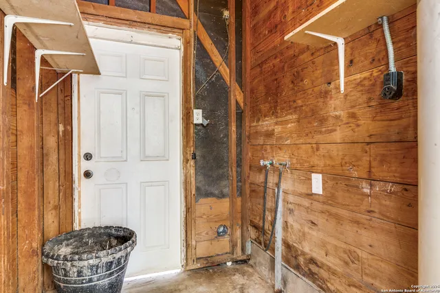 a bathroom with a glass door shower and a sink